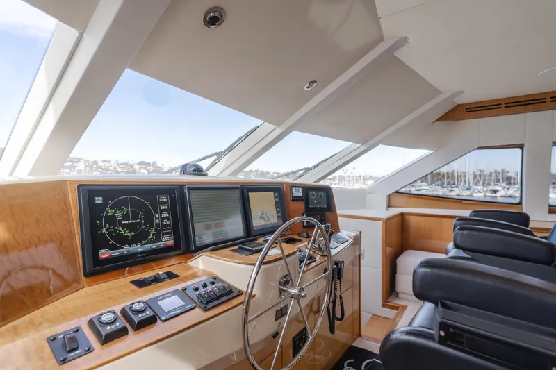 Slide: The Image of Interior helm of 2006 Hatteras 80 Motor Yacht with navigation equipment and leather seating. - 44