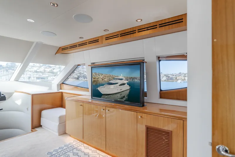 Slide: The Image of Luxurious interior of 2006 Hatteras 80 Motor Yacht with wood cabinetry and large windows. - 48