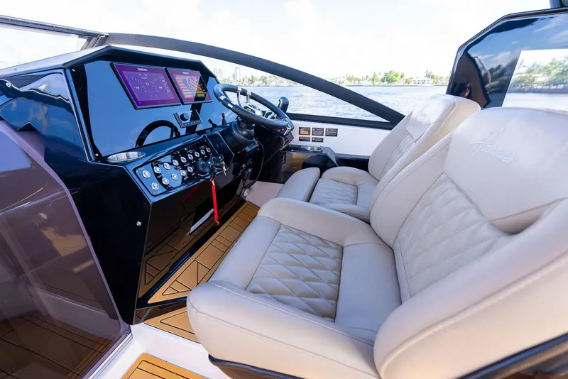 Slide: The Image of Luxurious interior of 2025 Hanover 347 Outboard boat with leather seating and modern dashboard. - 13