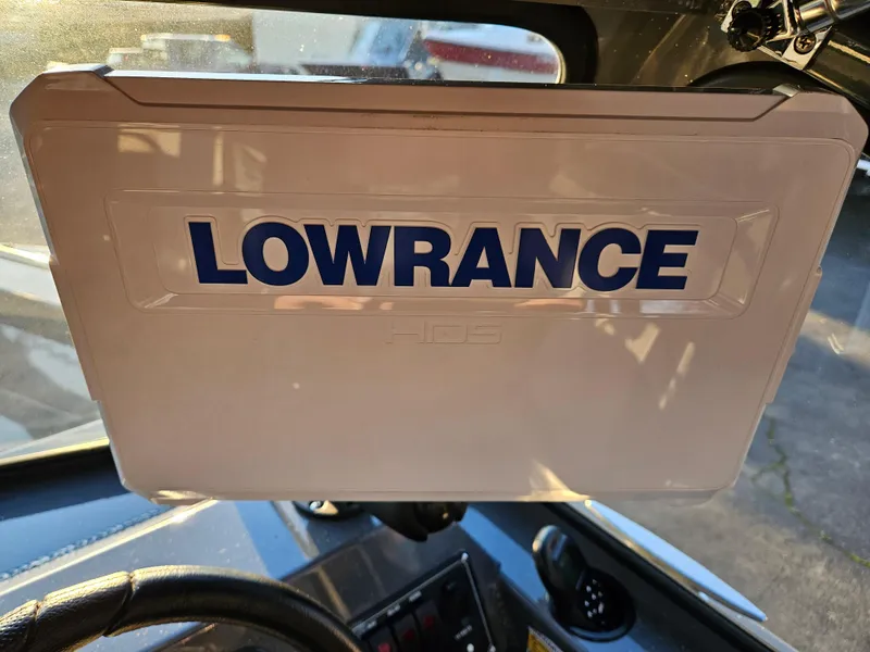 Slide: The Image of Lowrance device on 2023 RH Boats 18 Sport dashboard. - 10