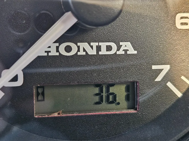 Slide: The Image of Close-up of a Honda gauge displaying 36.1, related to RH Boats 18 Sport 2023. - 12