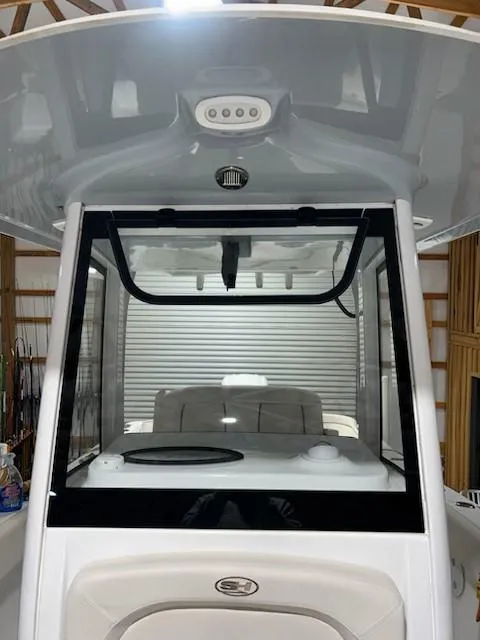 Slide: The Image of 2022 Sea Hunt Ultra 255 SE boat console in a storage facility. - 4