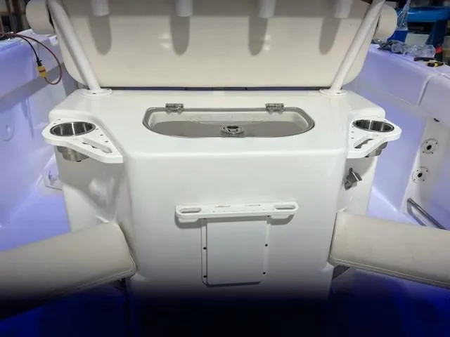 Slide: The Image of 2022 Sea Hunt Ultra 255 SE boat interior with seating and storage. - 8