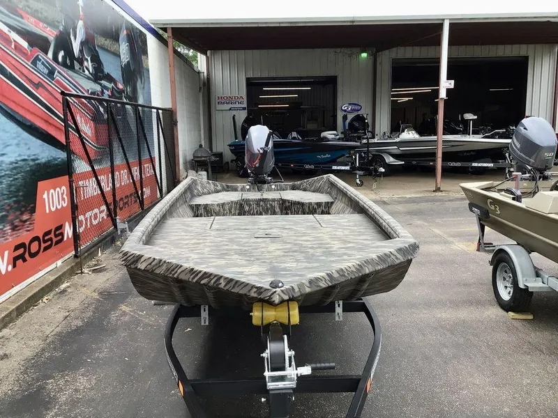 Slide: The Image of 2025 Reaper Boats 656 model displayed on a trailer outside a marine dealership. - 11