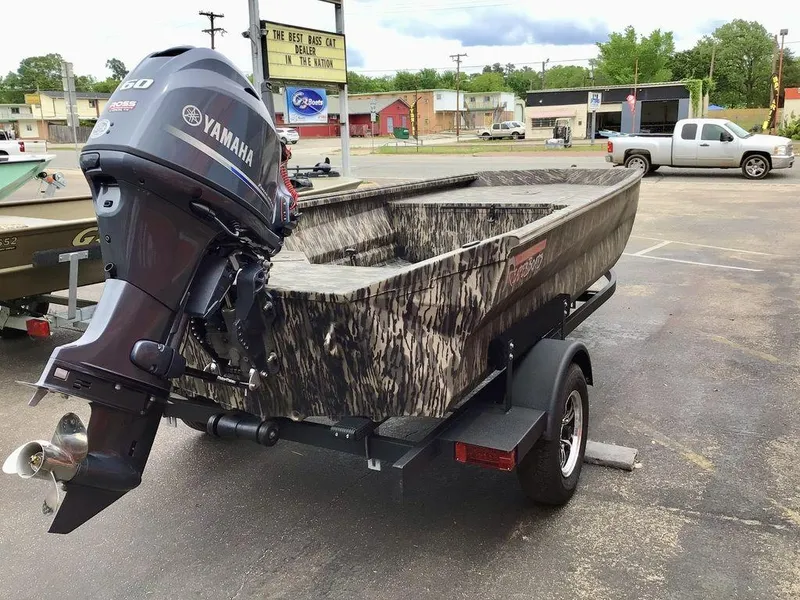 Slide: The Image of 2025 Reaper Boats 656 with Yamaha motor on trailer in parking lot. - 15
