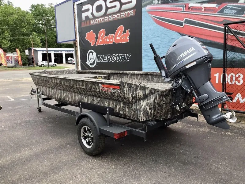Slide: The Image of 2025 Reaper Boats 656 with Yamaha motor on trailer, displayed at Ross Motorsports. - 16