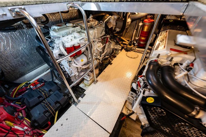 Slide: The Image of Engine room of 2004 Cruisers Yachts 455 Express Motoryacht with visible machinery and equipment. - 32