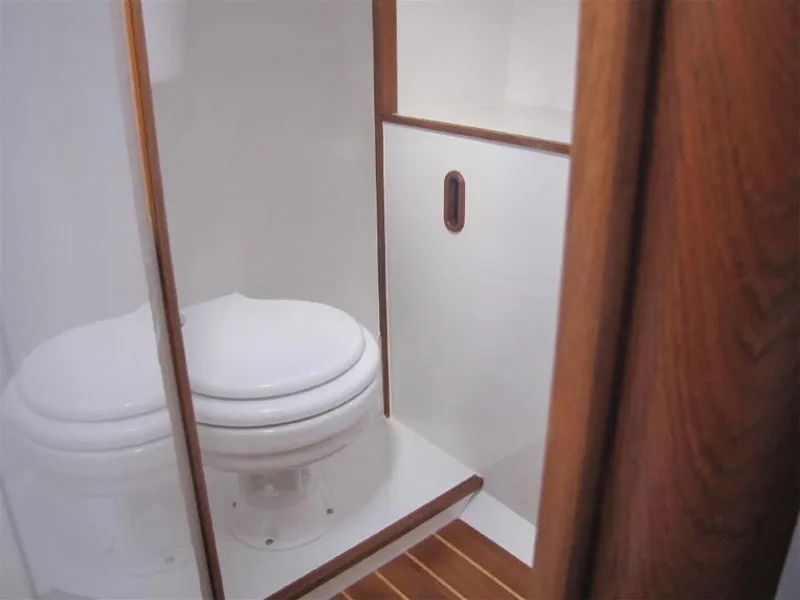 Slide: The Image of Modern bathroom in 2025 Rustler 33 yacht with wooden accents and sleek design. - 22