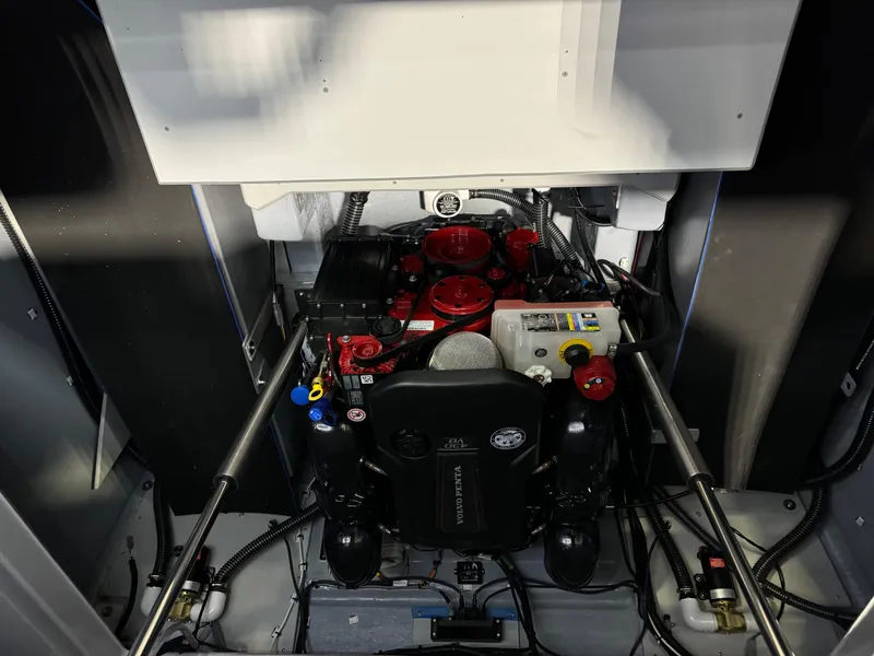Slide: The Image of Engine compartment of 2025 Paradigm 236 boat, showcasing detailed mechanical components. - 13