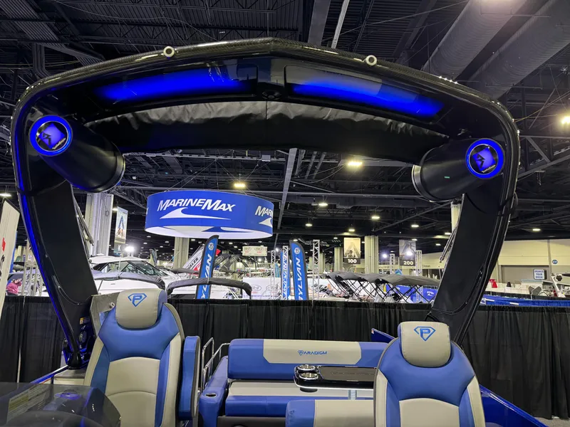 Slide: The Image of Paradigm 236 boat interior with blue LED lighting at a MarineMax event, 2025 model. - 5