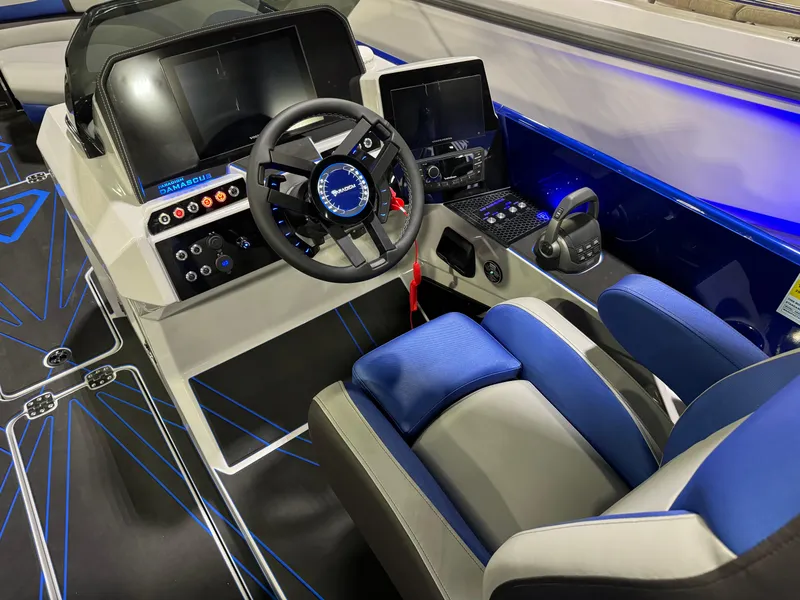 Slide: The Image of 2025 Paradigm 236 boat cockpit with modern controls and blue LED lighting. - 9