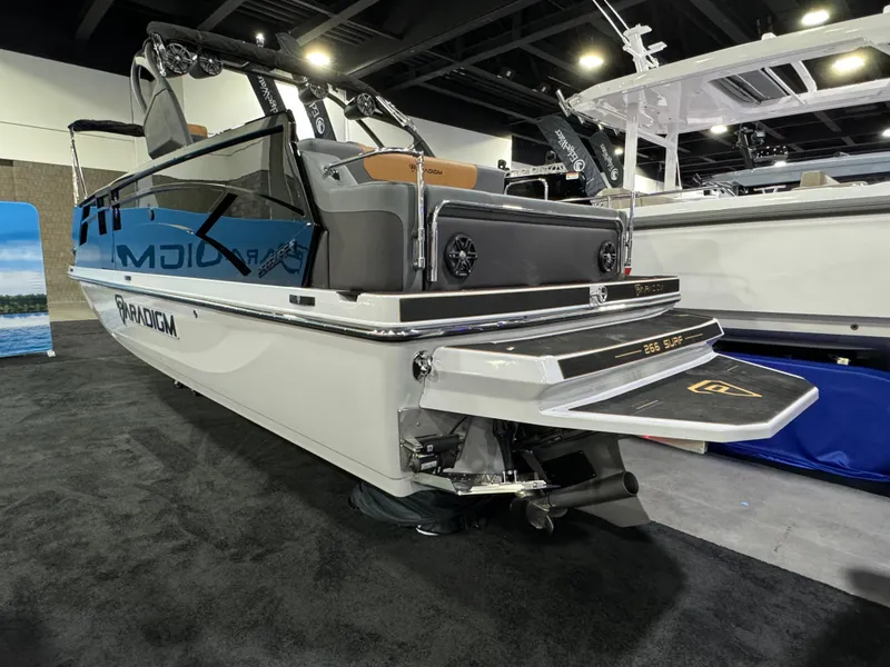 Slide: The Image of 2025 Paradigm Damascus 260 Surf boat displayed at an indoor exhibition. - 11