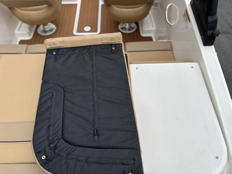 Slide: The Image of 2023 Bayliner VR4 boat interior with seating and storage area. - 16