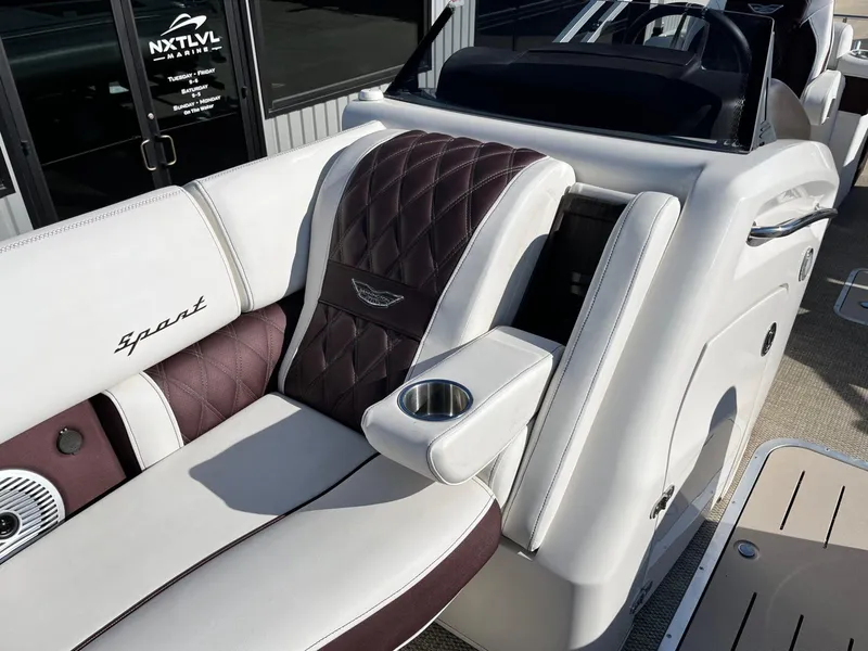 Slide: The Image of 2023 Bennington 23Q boat interior with luxurious seating and cup holder. - 14