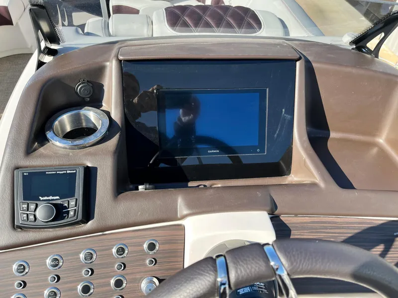 Slide: The Image of Dashboard of 2023 Bennington 23Q boat with Garmin display and control panel. - 20
