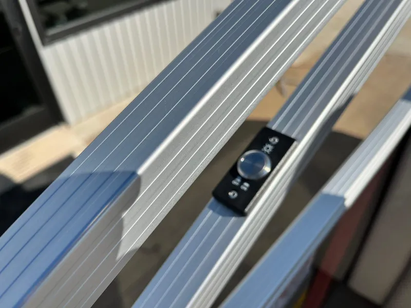 Slide: The Image of Close-up of 2023 Bennington 23Q boat railing with control knob. - 24