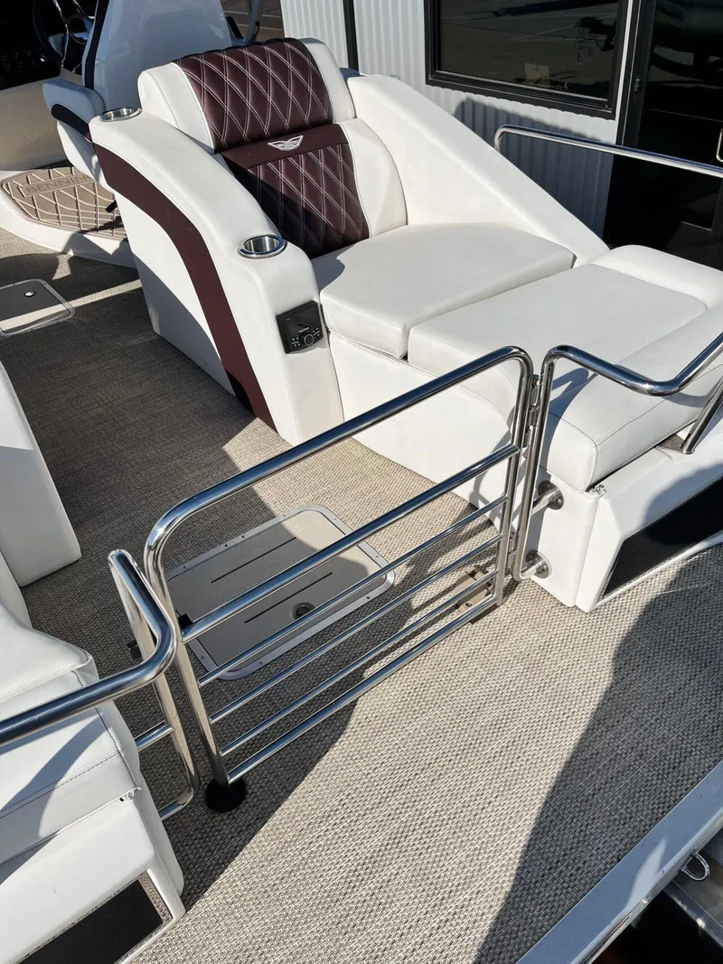 Slide: The Image of 2023 Bennington 23Q boat interior with plush seating and stainless steel railings. - 31