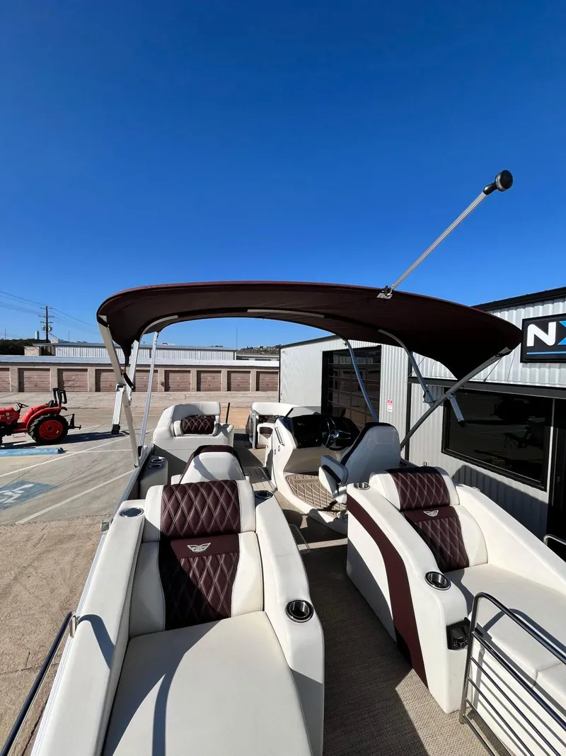 Slide: The Image of 2023 Bennington 23Q pontoon boat with canopy, featuring luxurious seating and modern design. - 33