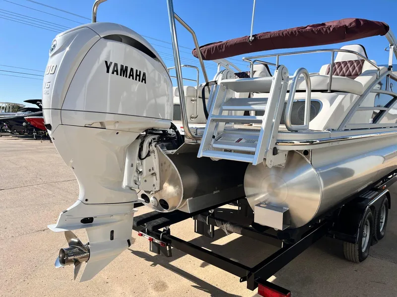 Slide: The Image of 2023 Bennington 23Q pontoon boat with Yamaha outboard motor, on a trailer. - 5