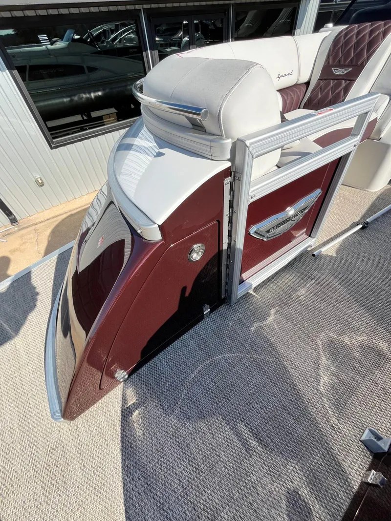 Slide: The Image of 2023 Bennington 23Q pontoon boat with maroon and white seating, viewed from above. - 9