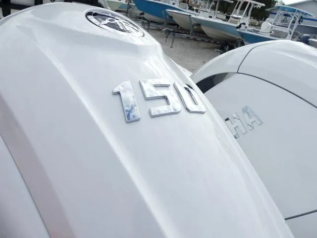 Slide: The Image of 2025 Key West 244 CC boat interior with Garmin navigation system and seating. - 10