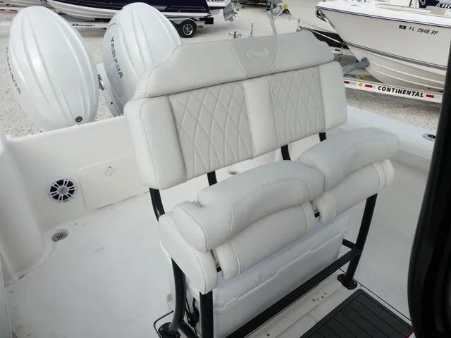 Slide: The Image of Key West 244 CC 2025 boat interior with KW logo mat and white seating. - 15