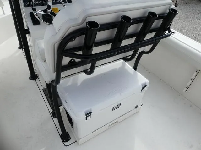 Slide: The Image of 2025 Key West 244 CC boat with rod holders and T-top in a marina setting. - 19