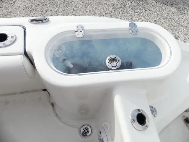 Slide: The Image of Livewell on 2025 Key West 244 CC boat, featuring a clear lid and white finish. - 21