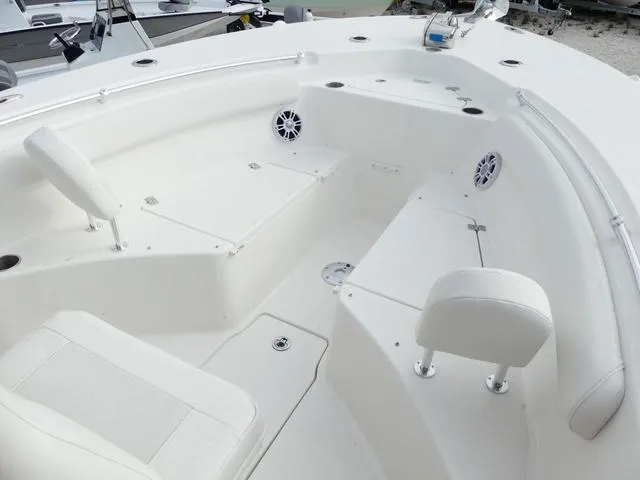Slide: The Image of 2025 Key West 244 CC boat interior with seating and storage compartments. - 24