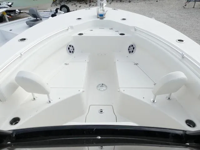 Slide: The Image of 2025 Key West 244 CC boat interior with seating and storage compartments. - 25