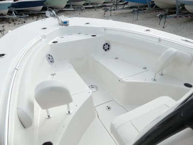 Slide: The Image of 2025 Key West 244 CC boat interior with rod holders and speakers. - 26