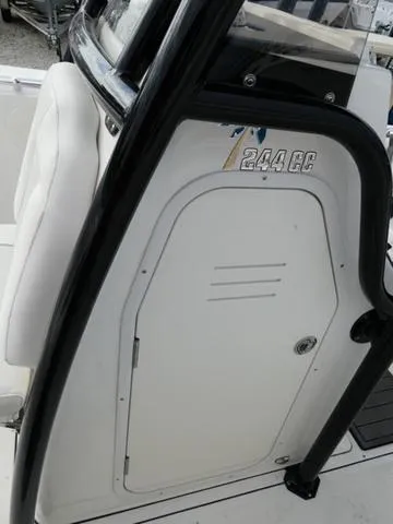 Slide: The Image of 2025 Key West 244 CC boat console with storage compartment and seating. - 30
