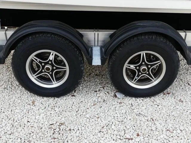 Slide: The Image of Close-up of a 2025 Key West 244 CC boat engine with "150" marking. - 9