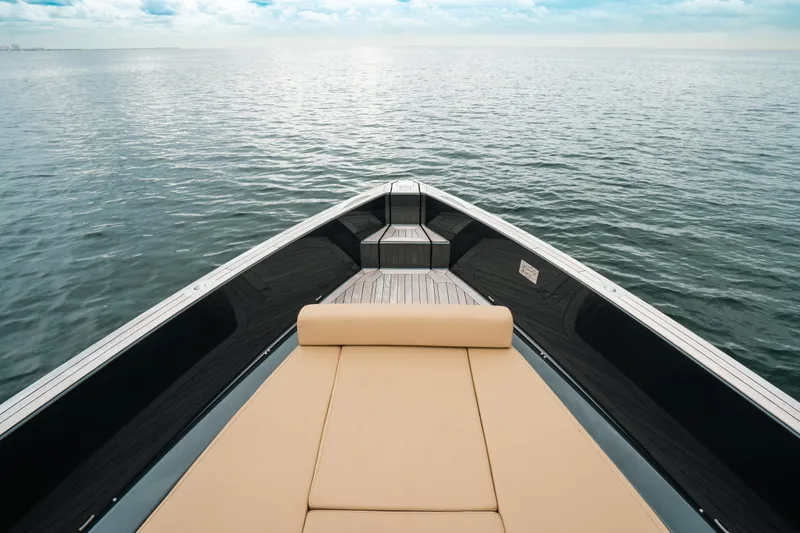 Slide: The Image of Bow view of 2022 Fjord 52 Open yacht on calm sea. - 12
