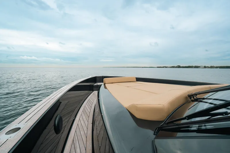 Slide: The Image of 2022 Fjord 52 Open yacht on calm waters, featuring sleek design and spacious deck. - 14