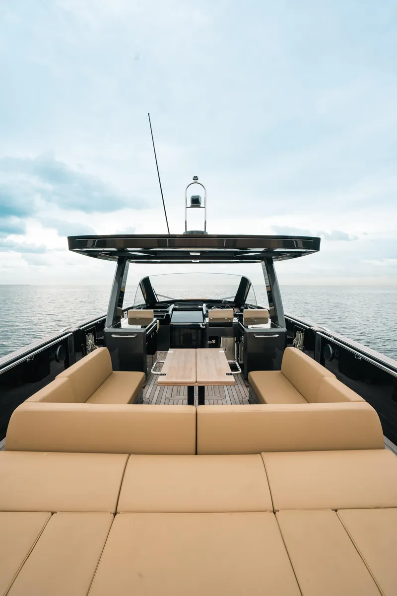 Slide: The Image of 2022 Fjord 52 Open yacht with spacious deck and seating, cruising on open water. - 20