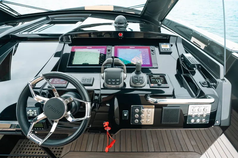 Slide: The Image of Helm of 2022 Fjord 52 Open yacht with advanced navigation systems and controls. - 22