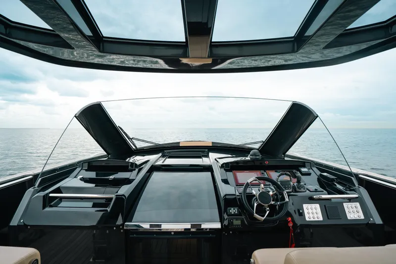 Slide: The Image of 2022 Fjord 52 Open yacht cockpit with modern controls, overlooking the ocean. - 23