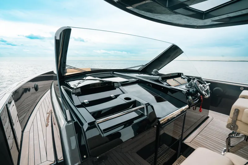 Slide: The Image of 2022 Fjord 52 Open yacht helm with sleek design and ocean view. - 24