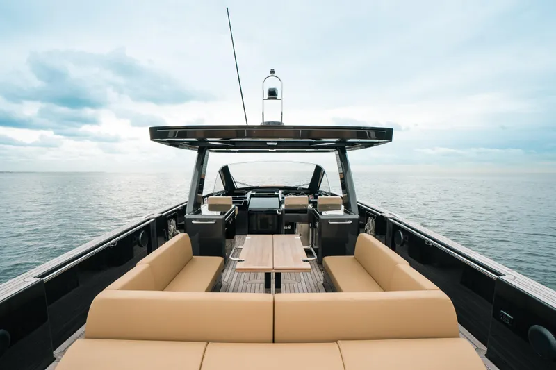 Slide: The Image of 2022 Fjord 52 Open yacht with spacious deck and seating, cruising on calm waters. - 27