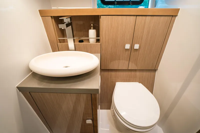Slide: The Image of Modern bathroom in 2022 Fjord 52 Open yacht with sleek fixtures and wooden cabinetry. - 39