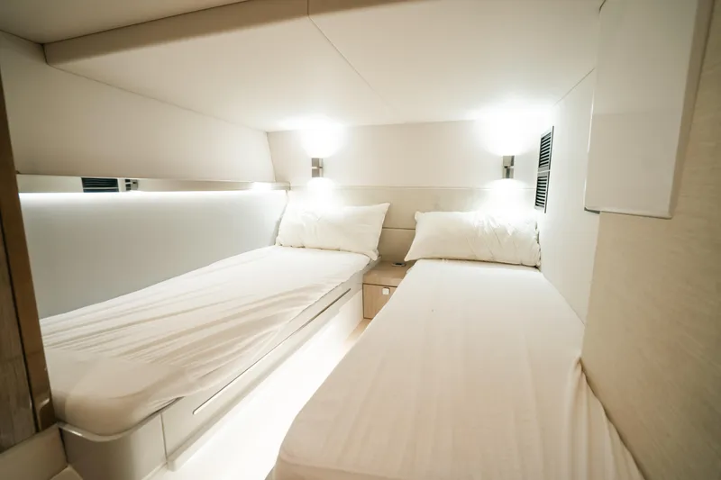 Slide: The Image of Luxurious twin cabin interior of 2022 Fjord 52 Open yacht, featuring modern design and ambient lighting. - 40