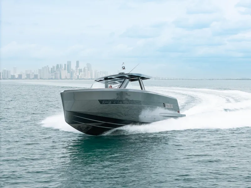 Slide: The Image of 2022 Fjord 52 Open yacht cruising on ocean with city skyline in background. - 5