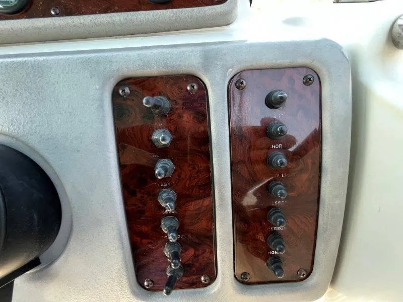 Slide: The Image of Control panel of a 1996 Chaparral Sunesta 250 boat with toggle switches. - 20