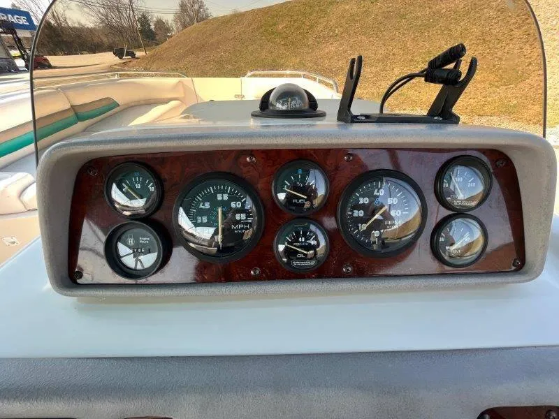 Slide: The Image of Dashboard of a 1996 Chaparral Sunesta 250 boat with gauges and controls. - 22