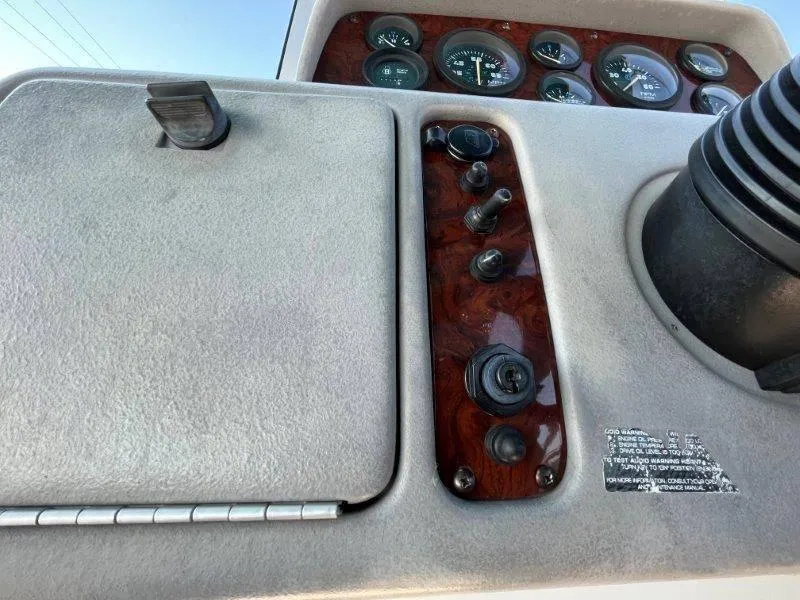 Slide: The Image of 1996 Chaparral Sunesta 250 dashboard with gauges and controls. - 23