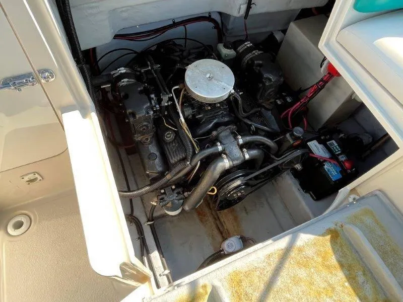 Slide: The Image of Engine compartment of a 1996 Chaparral Sunesta 250 boat, showing detailed components. - 24