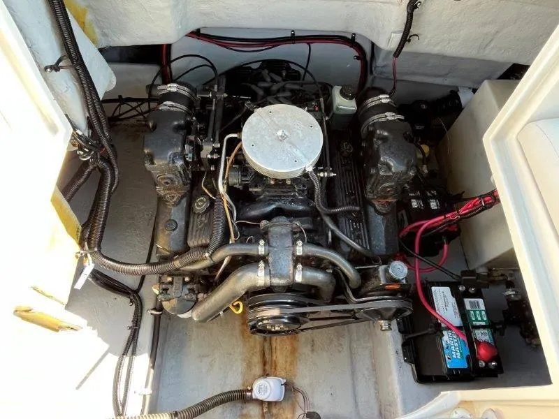 Slide: The Image of Engine compartment of a 1996 Chaparral Sunesta 250 boat, showing detailed mechanical components. - 30