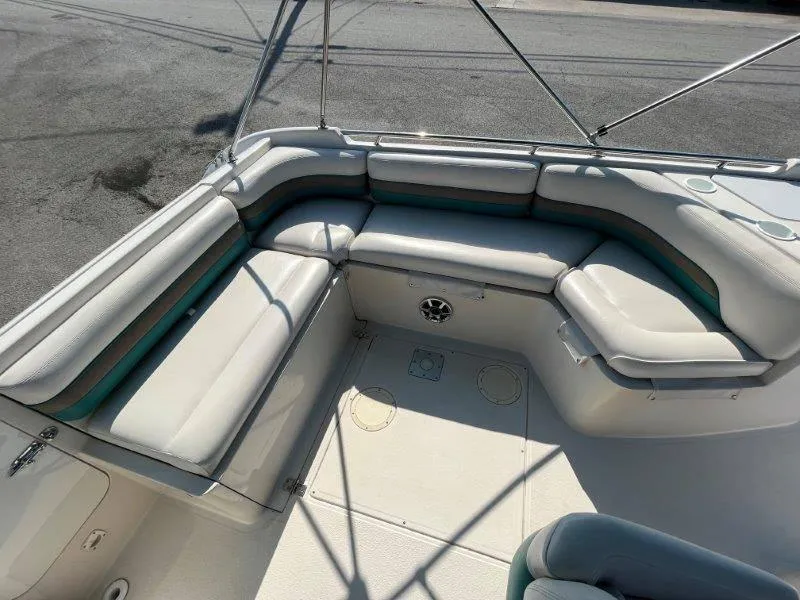 Slide: The Image of 1996 Chaparral Sunesta 250 boat interior with cushioned seating and spacious layout. - 31