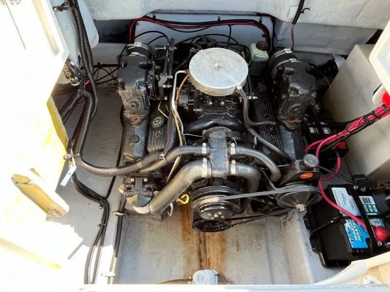 Slide: The Image of Engine compartment of a 1996 Chaparral Sunesta 250 boat, showing detailed mechanical components. - 32